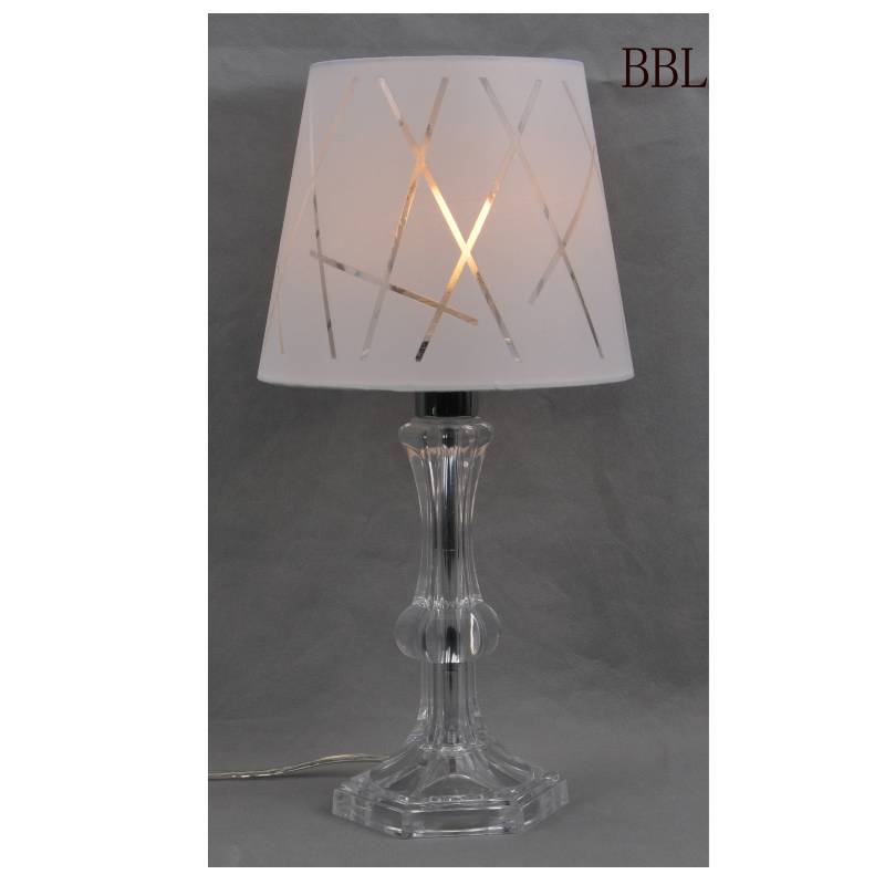 Pöytälamppu, jossa on kangasvarjo ja läpinäkyvä akryylilamppujen runko