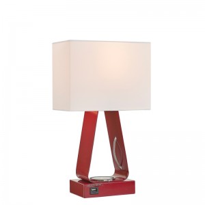 Pieni työpöytävalaisin, jossa on punainen viimeistely, USB -latausportti, langaton latausasema ja on/off -rokkarikytkin huoneessa