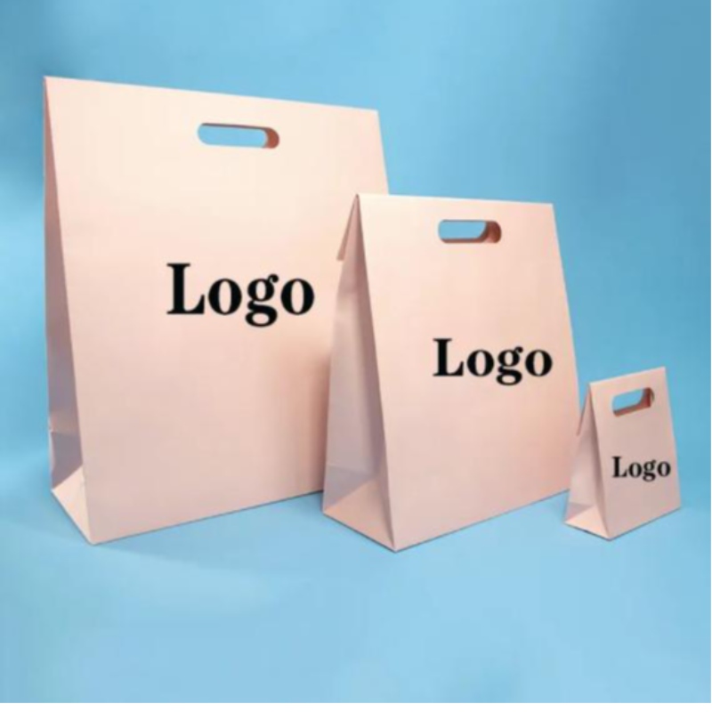 Uudelleenkäytettävä die cut kahva uv räätälöity logo hää syntymäpäivälahja vaaleanpunainen vaatetuspakkaus värikäs muotoilupaperi ostoskassi