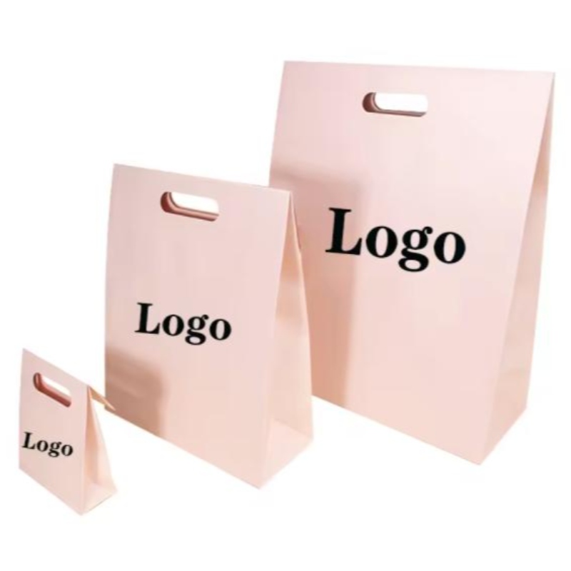 Uudelleenkäytettävä die cut kahva uv räätälöity logo hää syntymäpäivälahja vaaleanpunainen vaatetuspakkaus värikäs muotoilupaperi ostoskassi