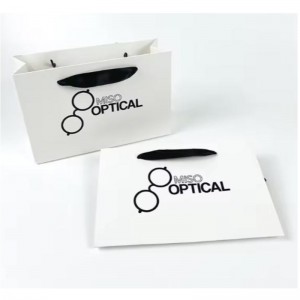 Painetut paperipussit pahvi ylellinen valkoinen Kraft -paperilahjapussinauhankahva ostoskassilla omalla logollasi